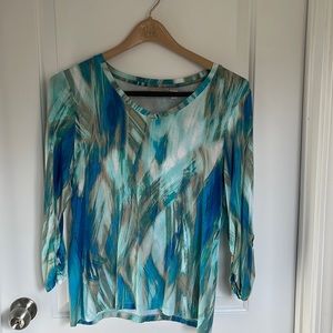 Chicos v neck,rayon and spandex, soft washable . Never worn, 3/4 length sleeve